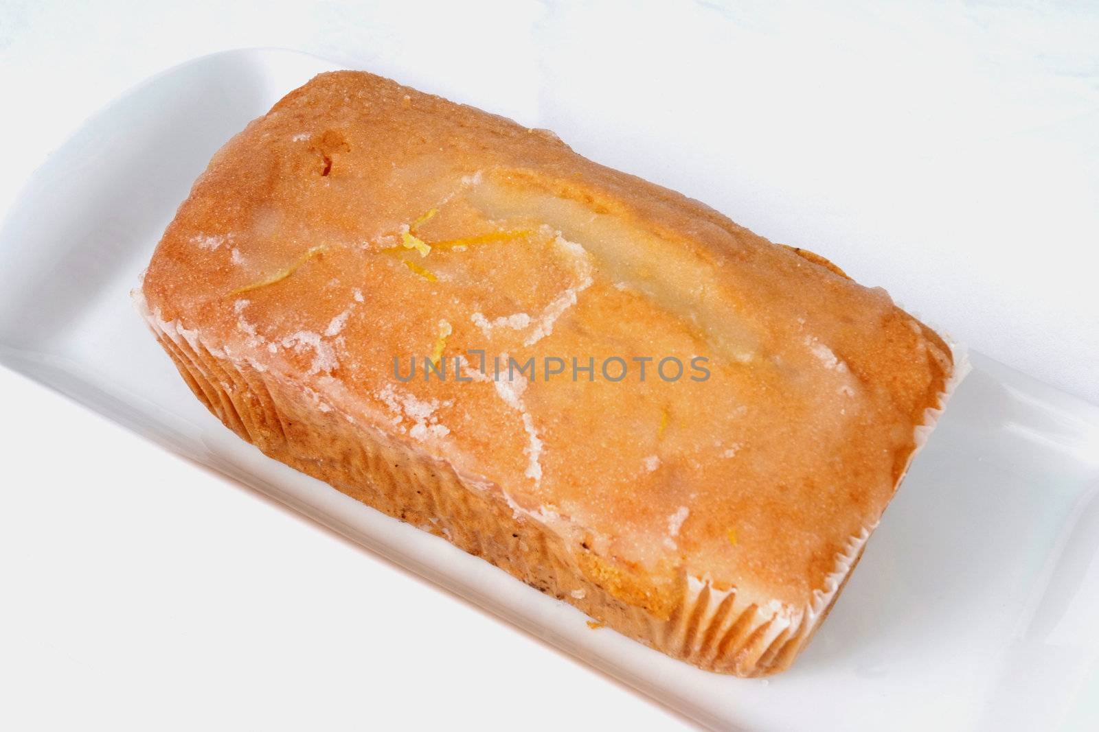 Mass-produced catering trade cake on a white background