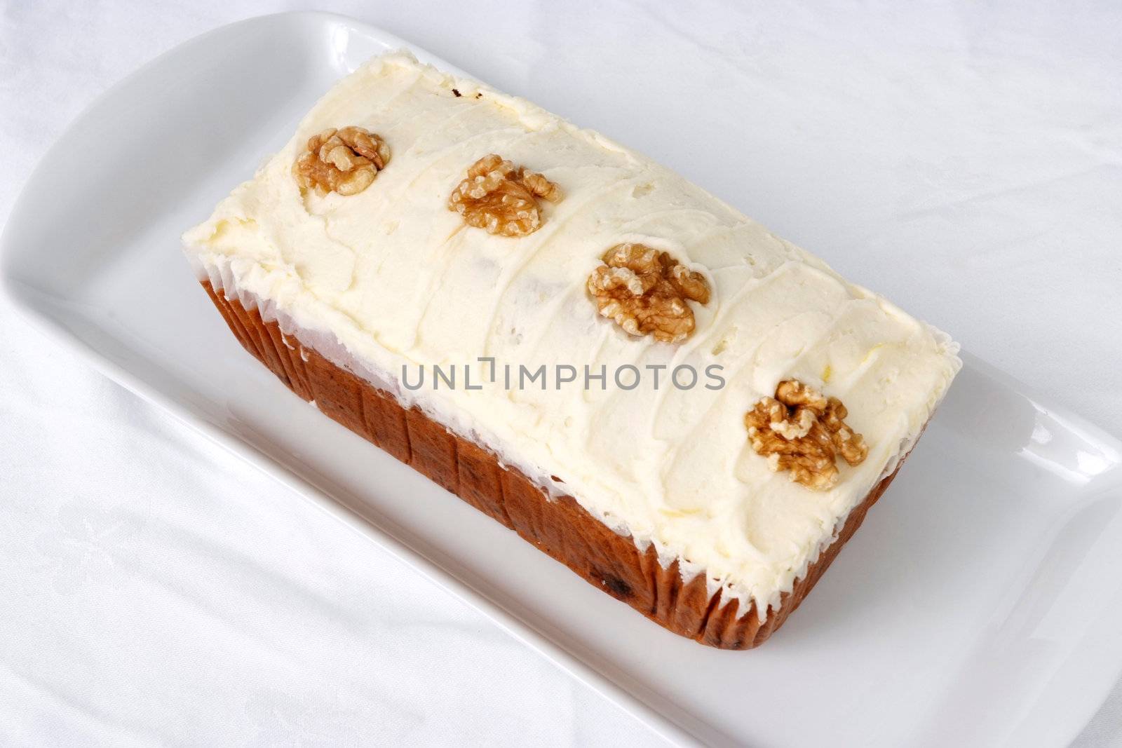 Mass-produced catering trade cake on a white background