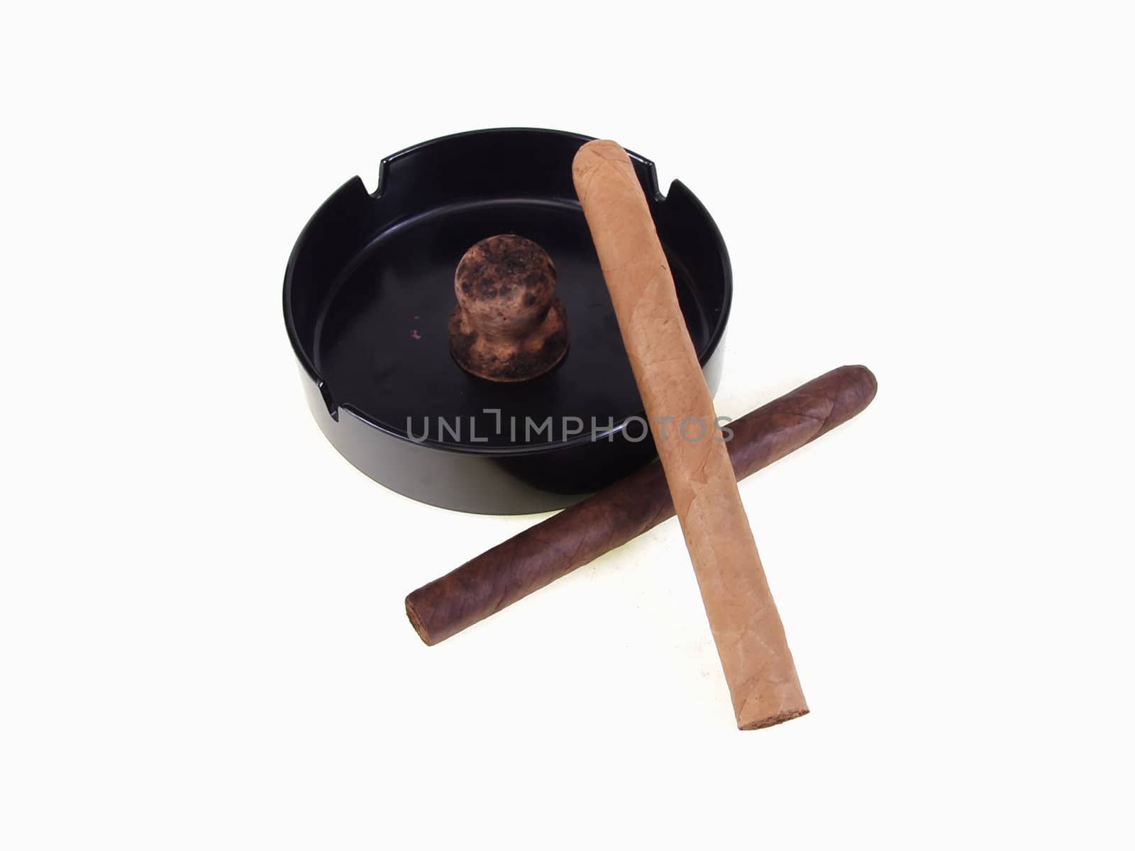 Two unlit cigars with a clean ashtray over a white background with room for text