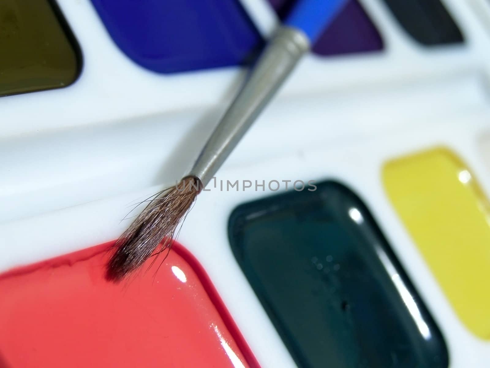 The multicolored aquarelle with one paintbrush
