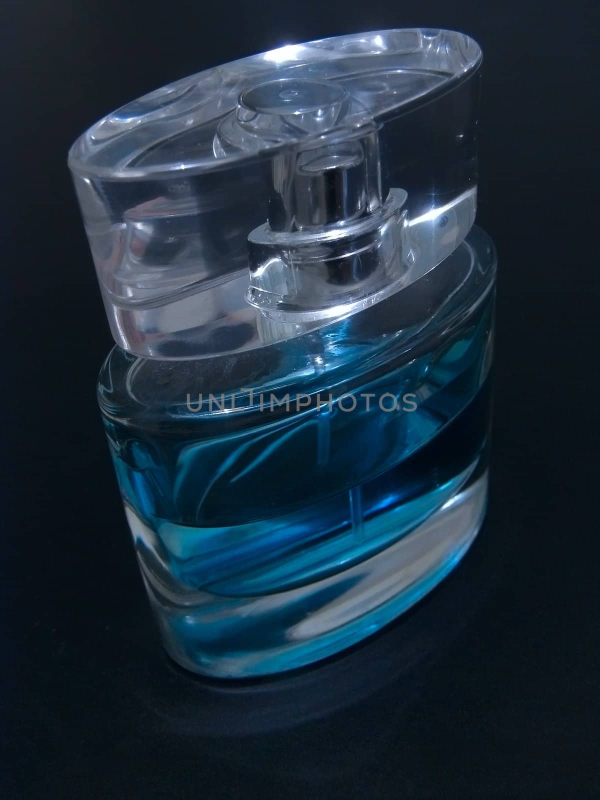 Woman blue parfume against the black background