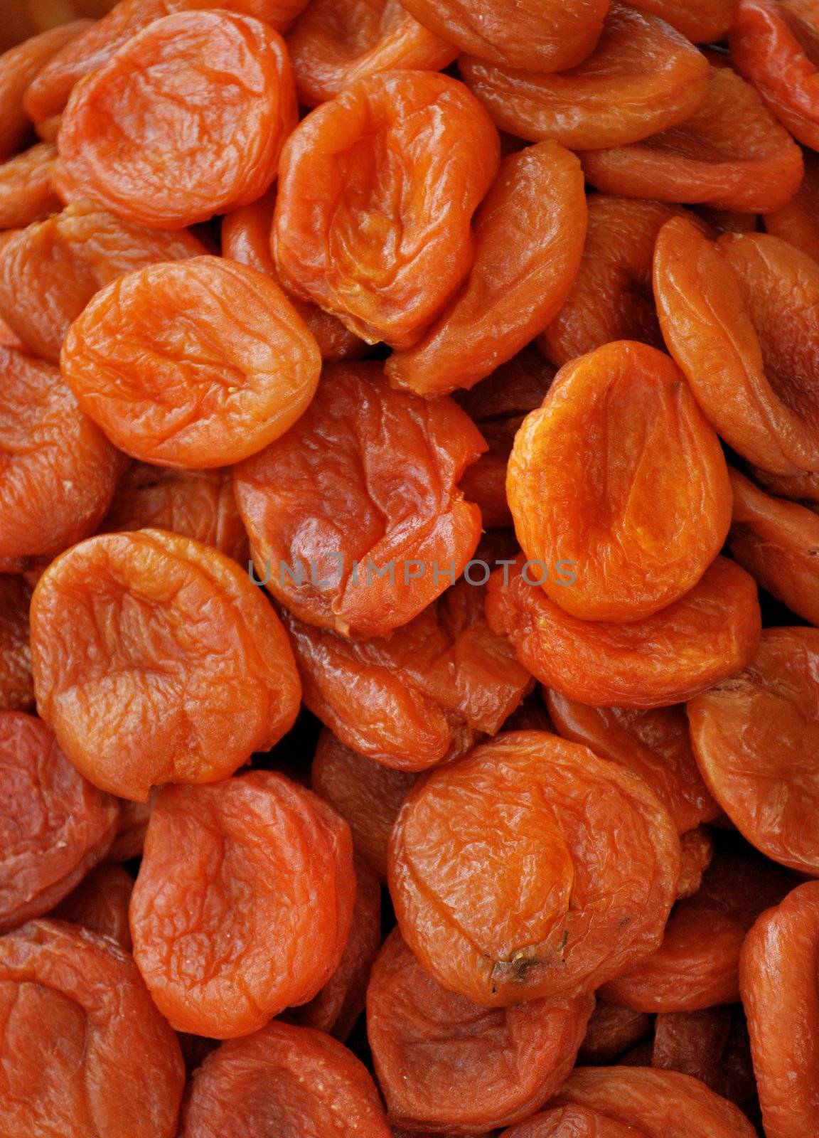 Dark dried apricots close up