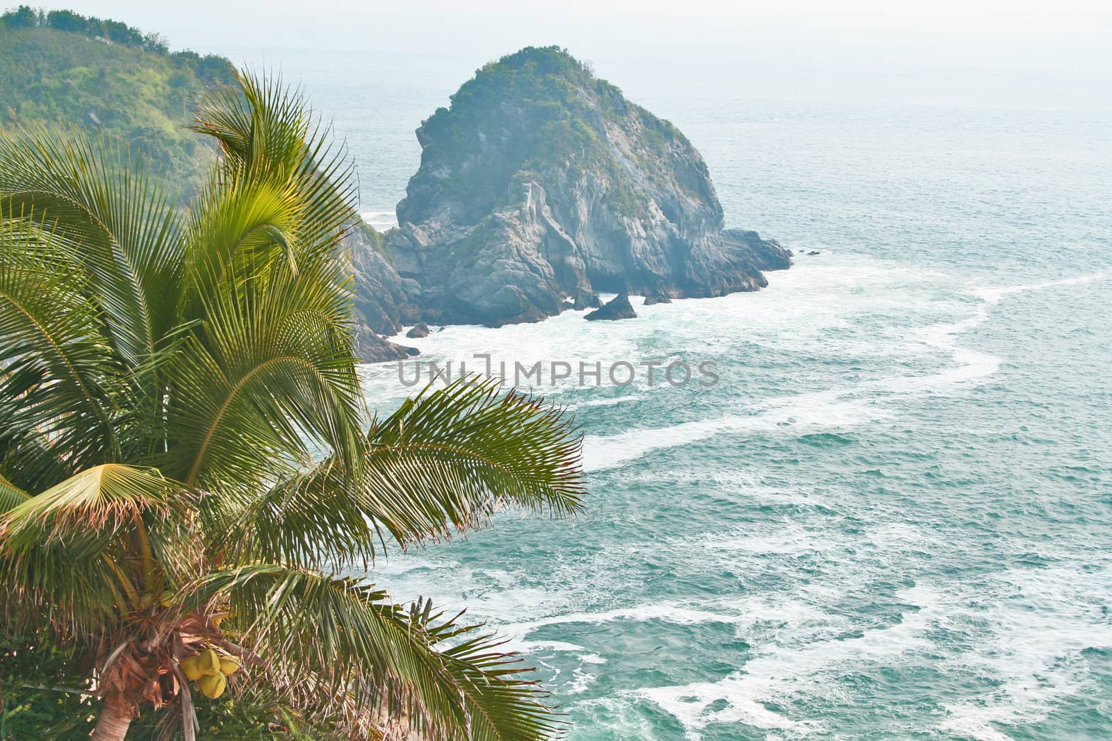 Waves crashing against rocky point