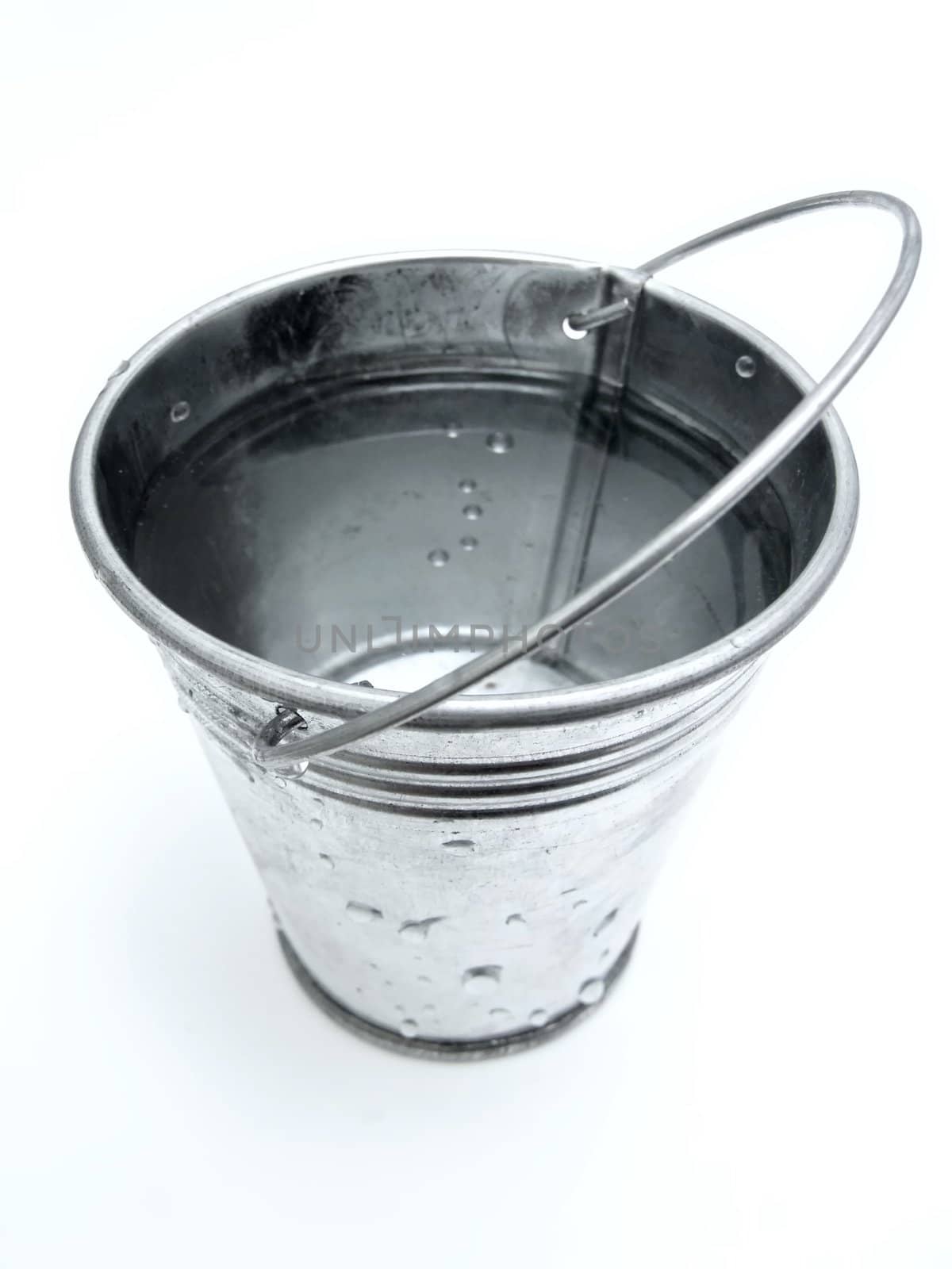 The metallic bucket full of water