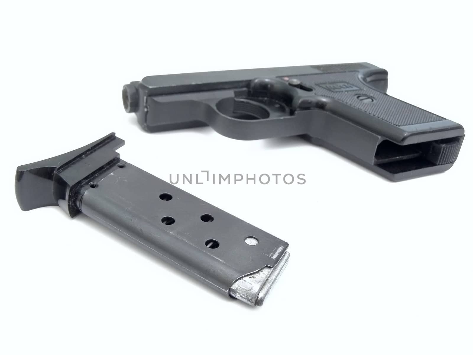 Military gun with charger against the white background