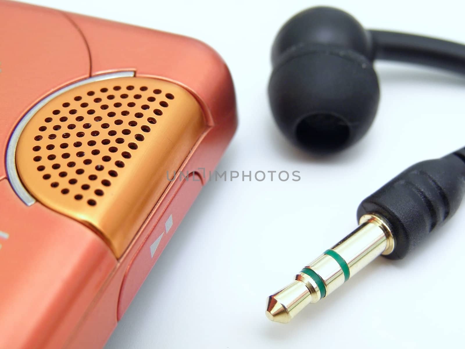 speaker, plug and earpiece over the white table