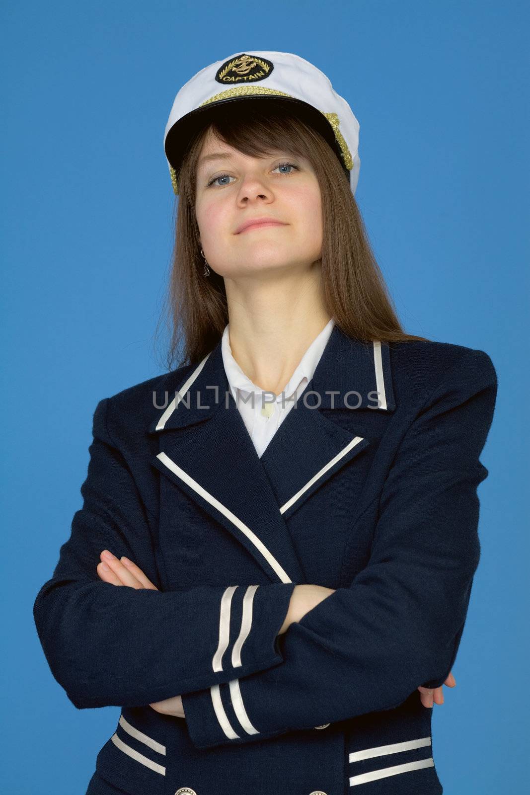 Portrait of the proud woman - the sea captain on blue