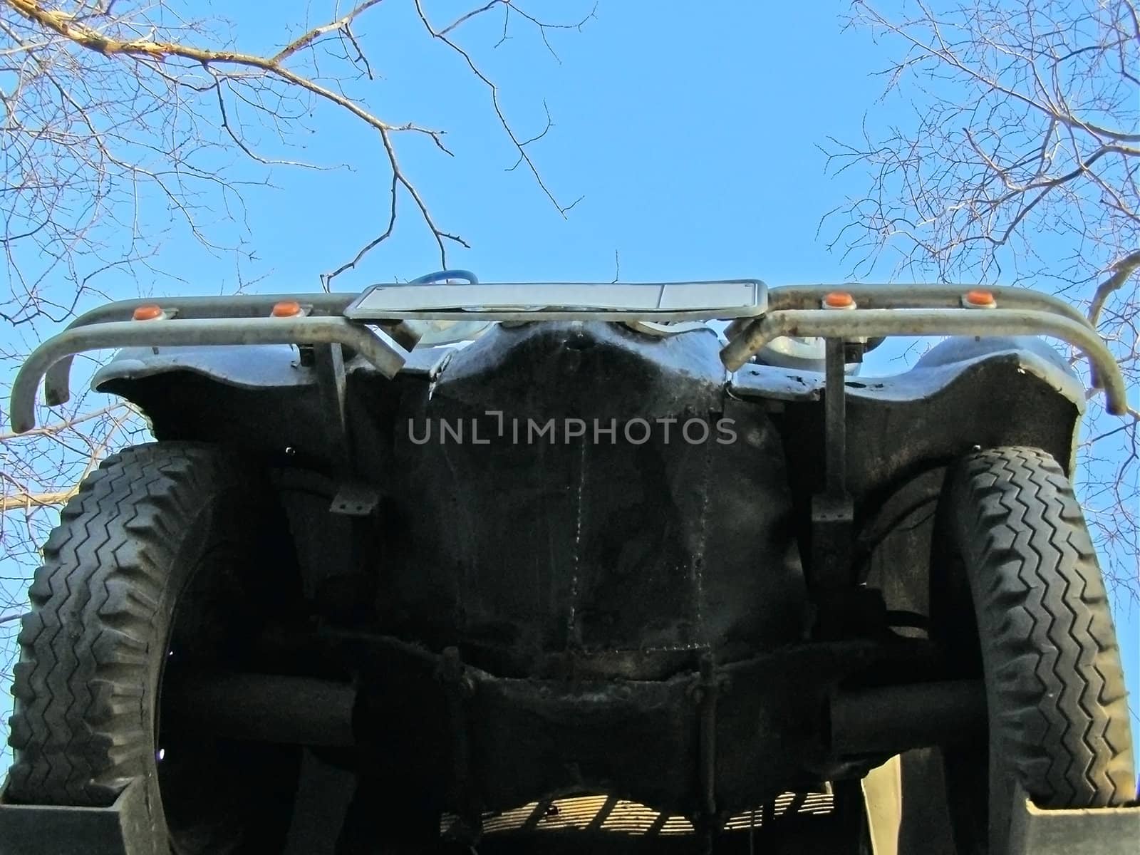 underneath of the car against blue sky
