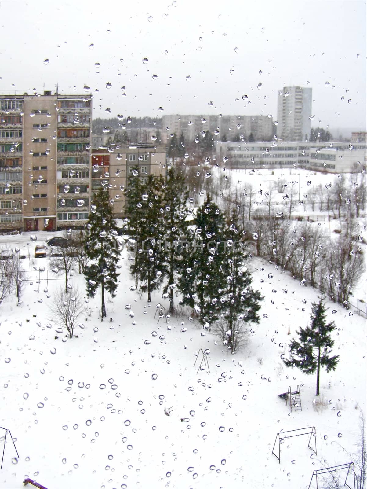 Town view through the window with the drops
