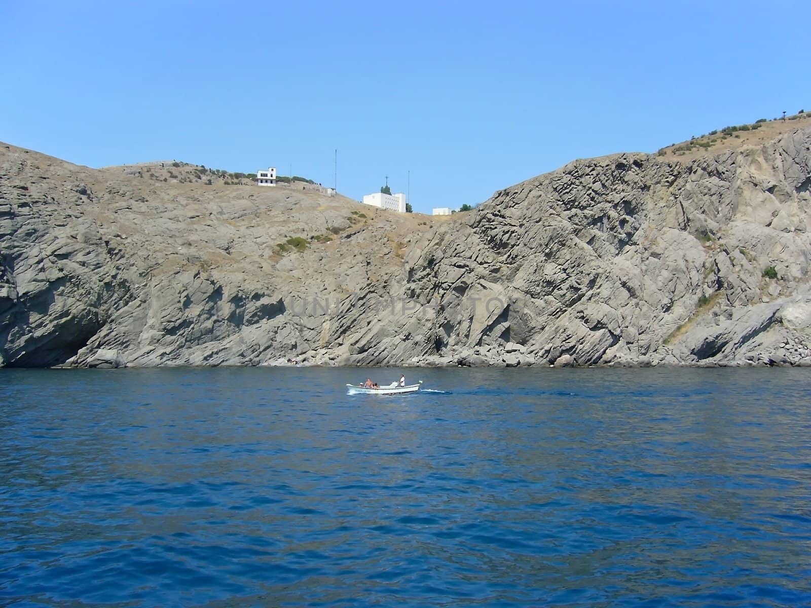 Summer sunny landscape with sea and rock