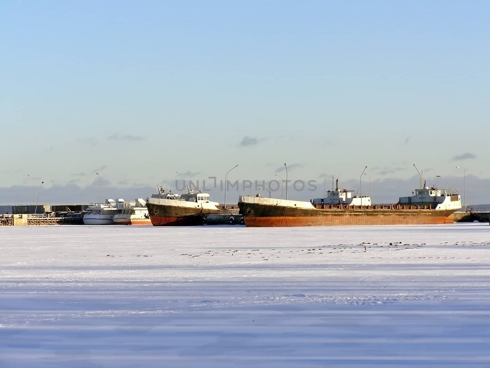Many ships in ice of the frozen winter sea