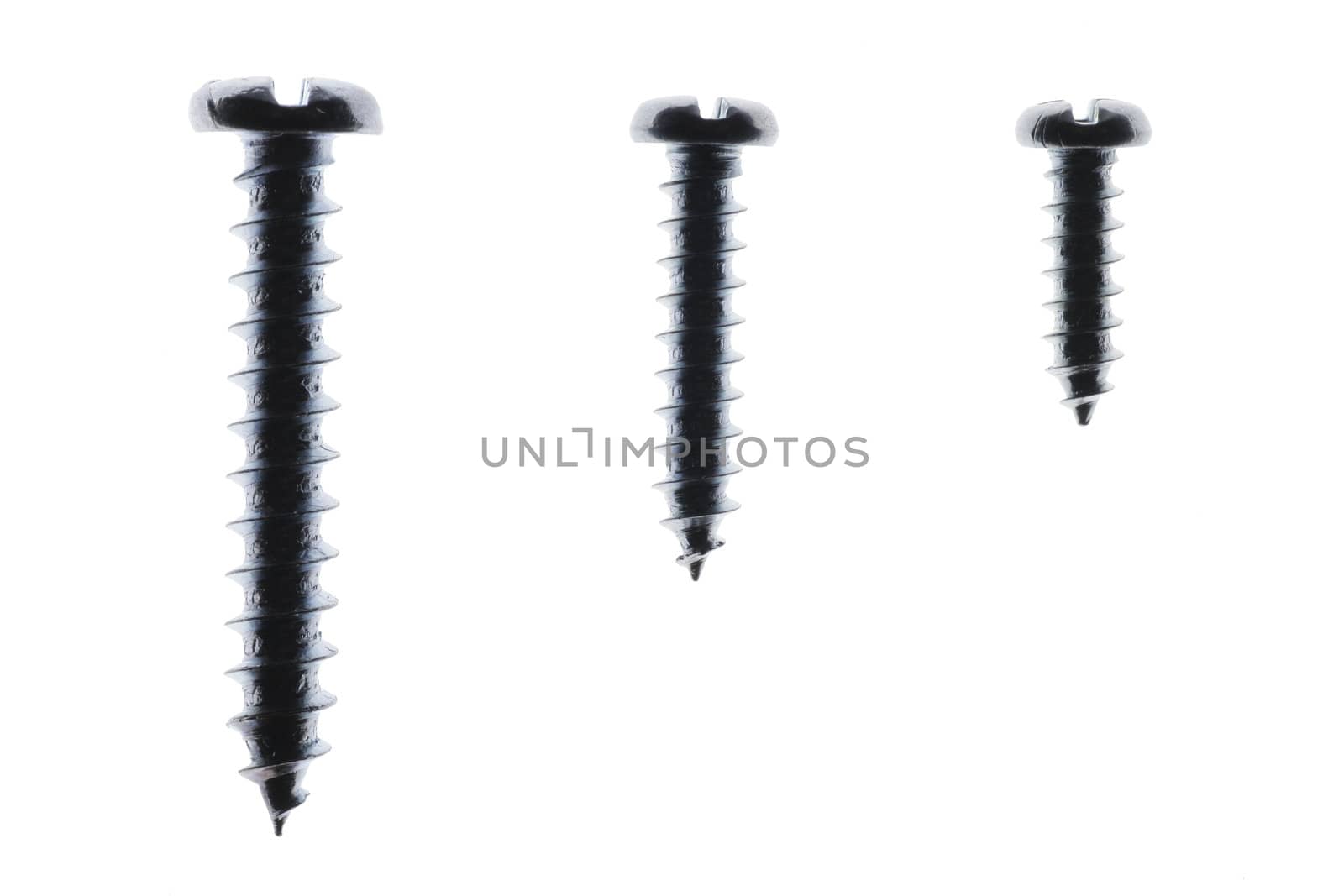 Macro Close-Up Of Three Spiral Metal Screws On A White Background