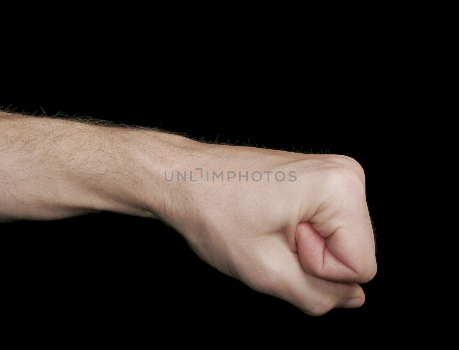 Fist, Closed Human Hand, Caucasian Skin Tone, Black Background