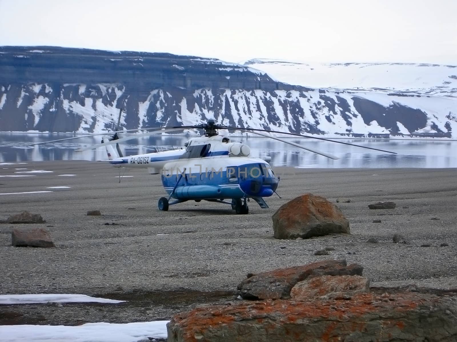 aircraft at the rest near small lake in mountains