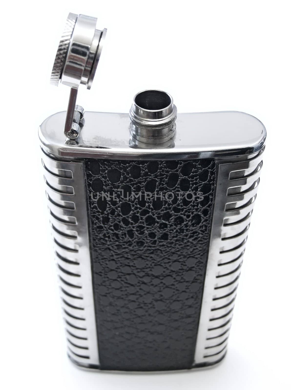 metallic open flask with alcohol against the white bacground