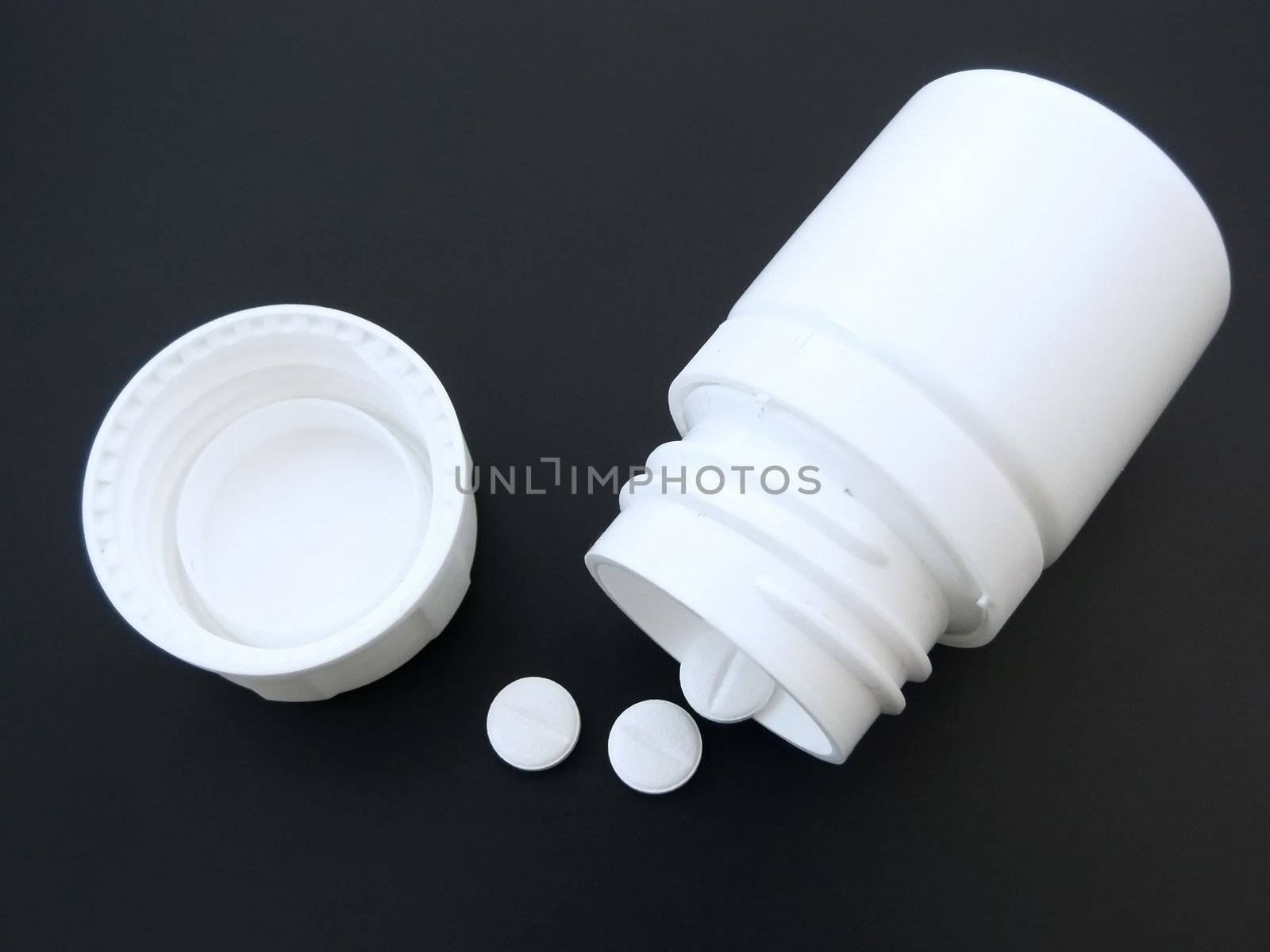 white tablets and  box on the black table