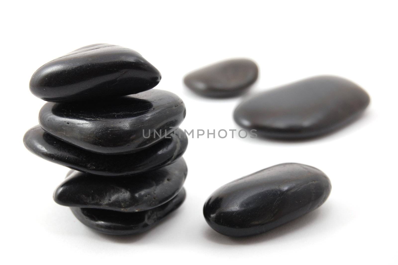 black stones in balance isolated on white background