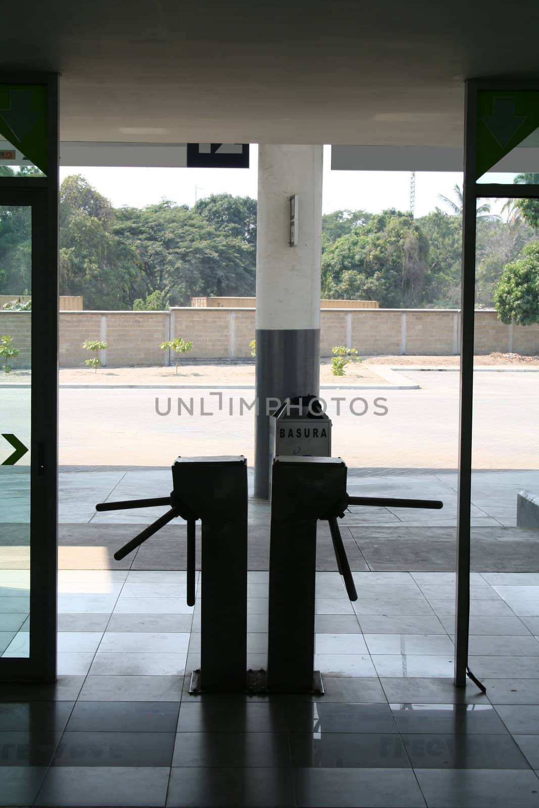 silouette of turnstile at station
