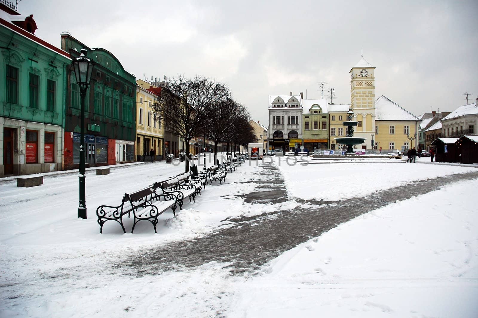 snowy karvina square with tower, horizontally framed shot