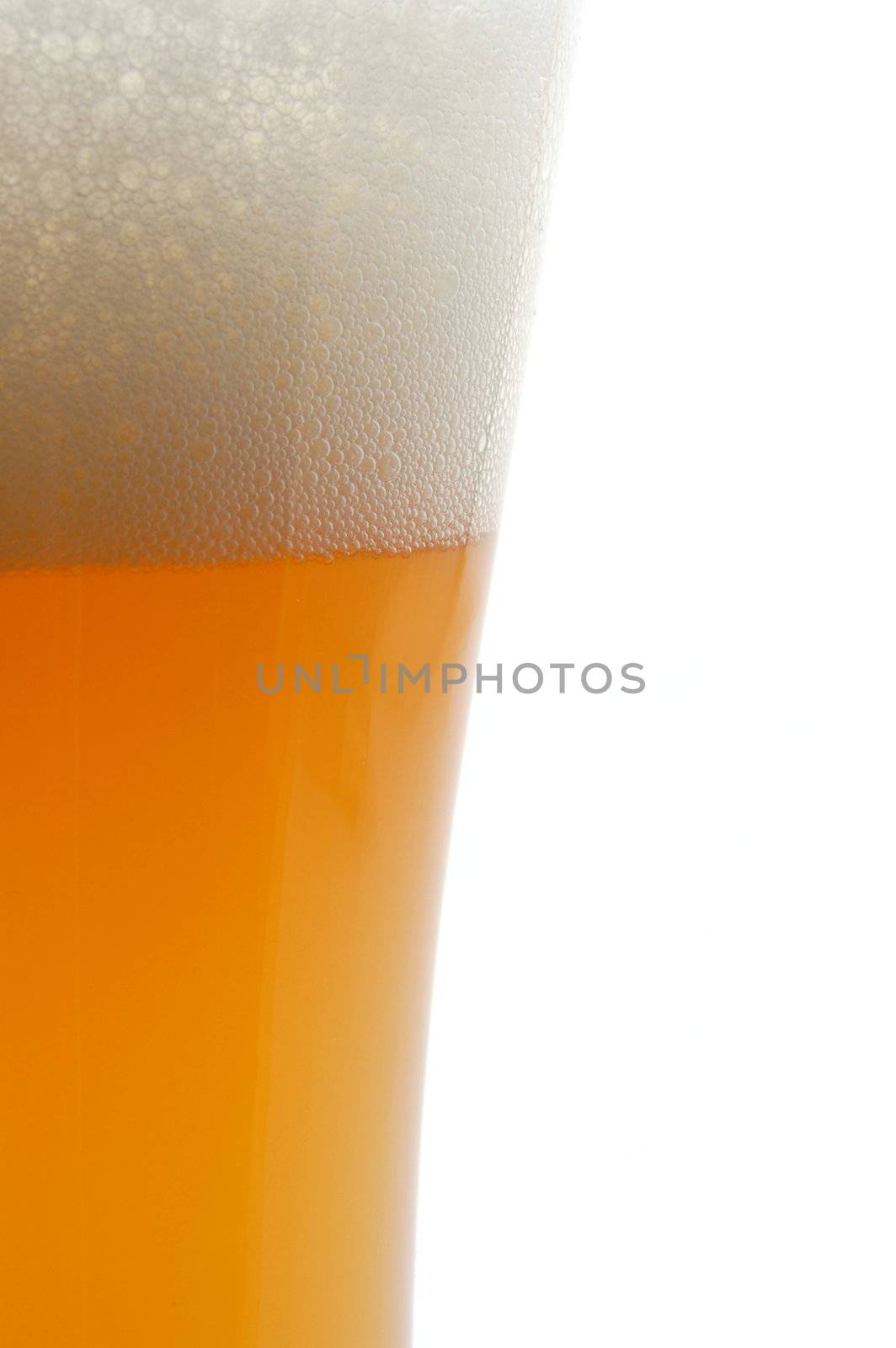 glass of german beer with foam foam and bubbles