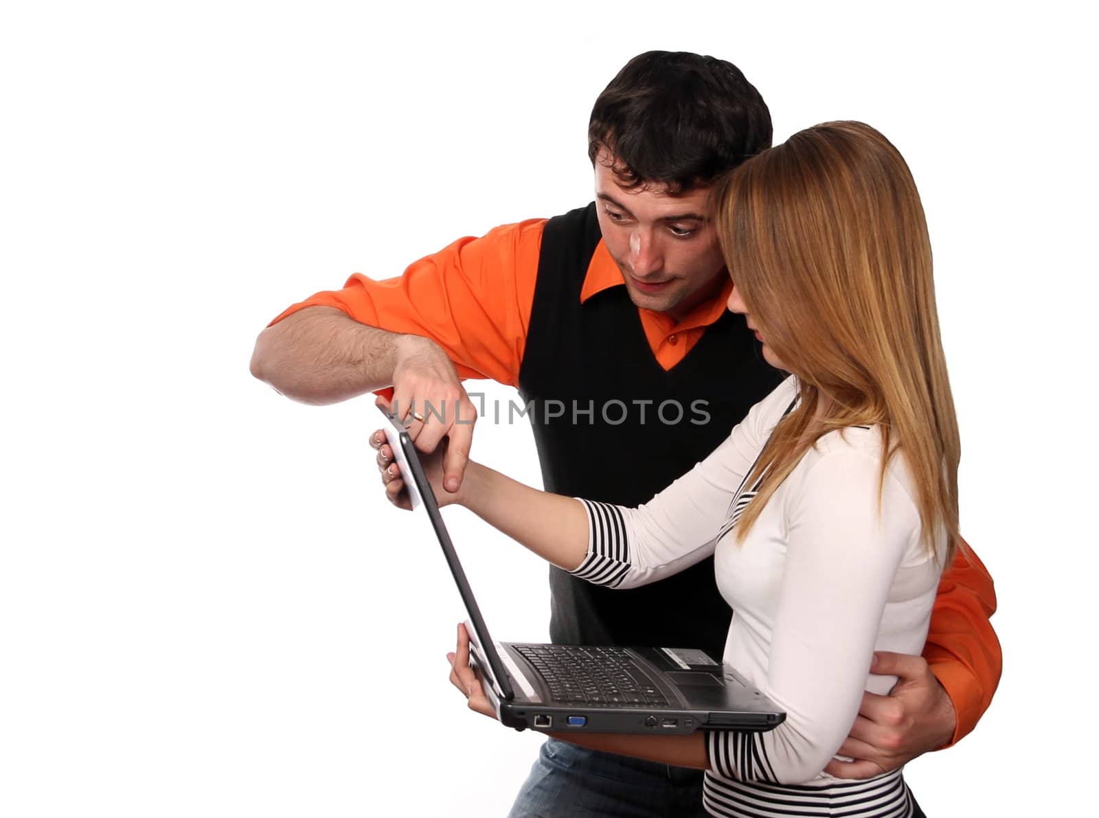 couple working with laptop, pretty blonde and handsome young dark haired man