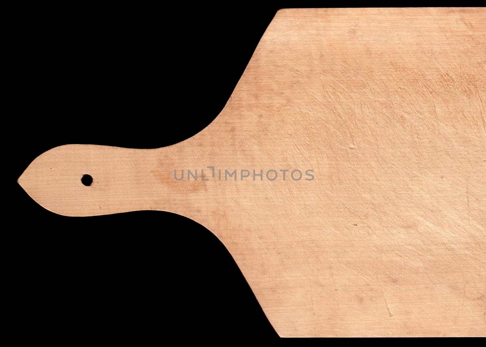 Wooden cooking board on black