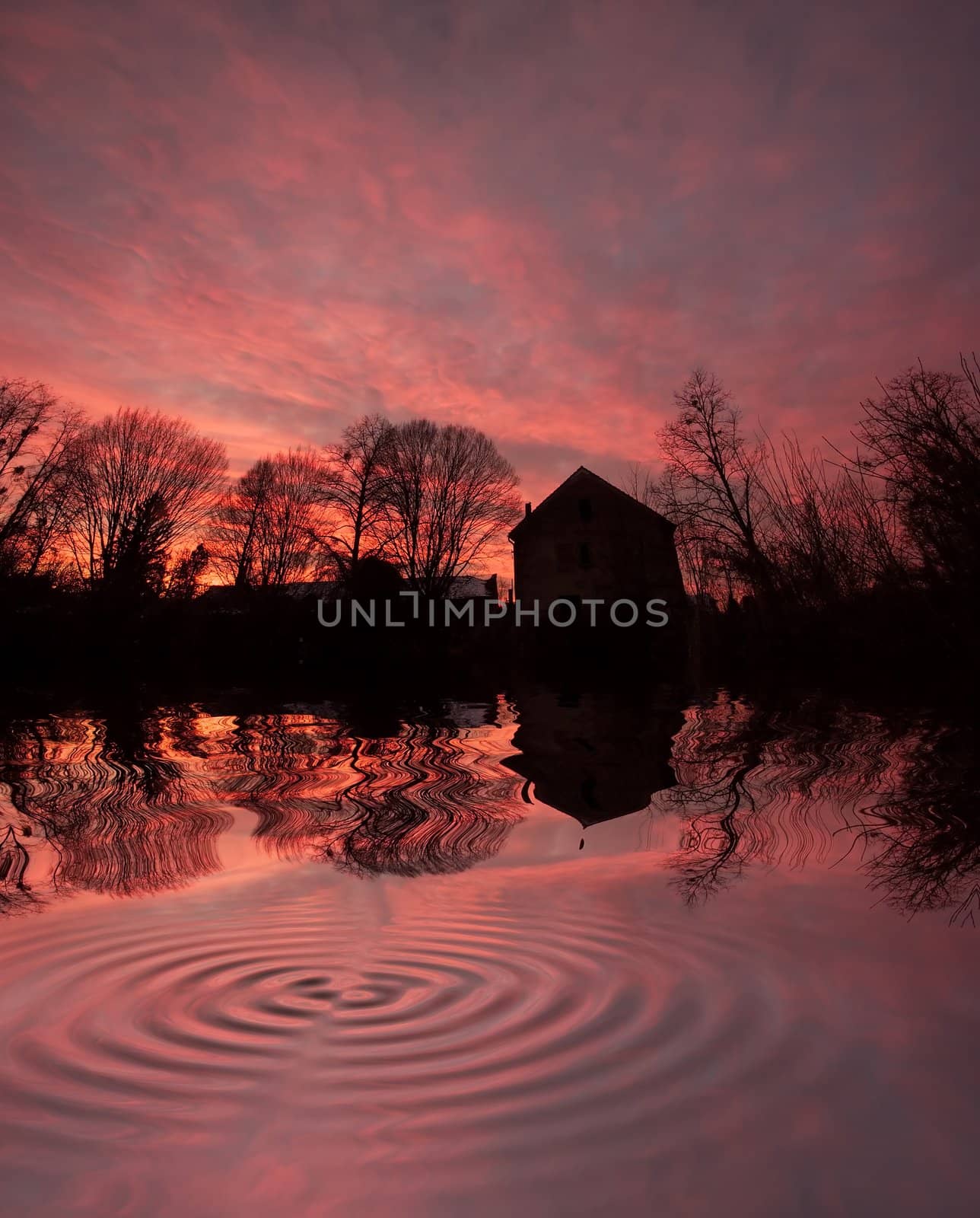house at sunset with reflection