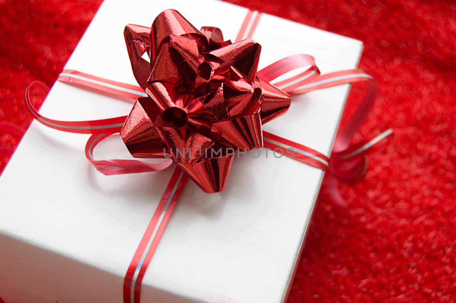 Gift box with red satin ribbon by Angel_a
