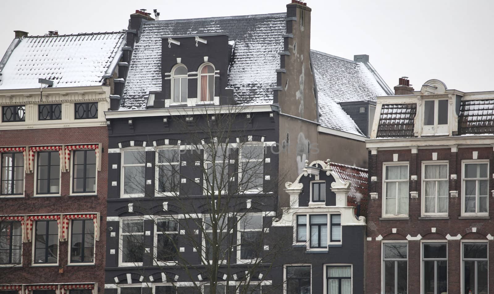 Amsterdam apartments in the winter snow.