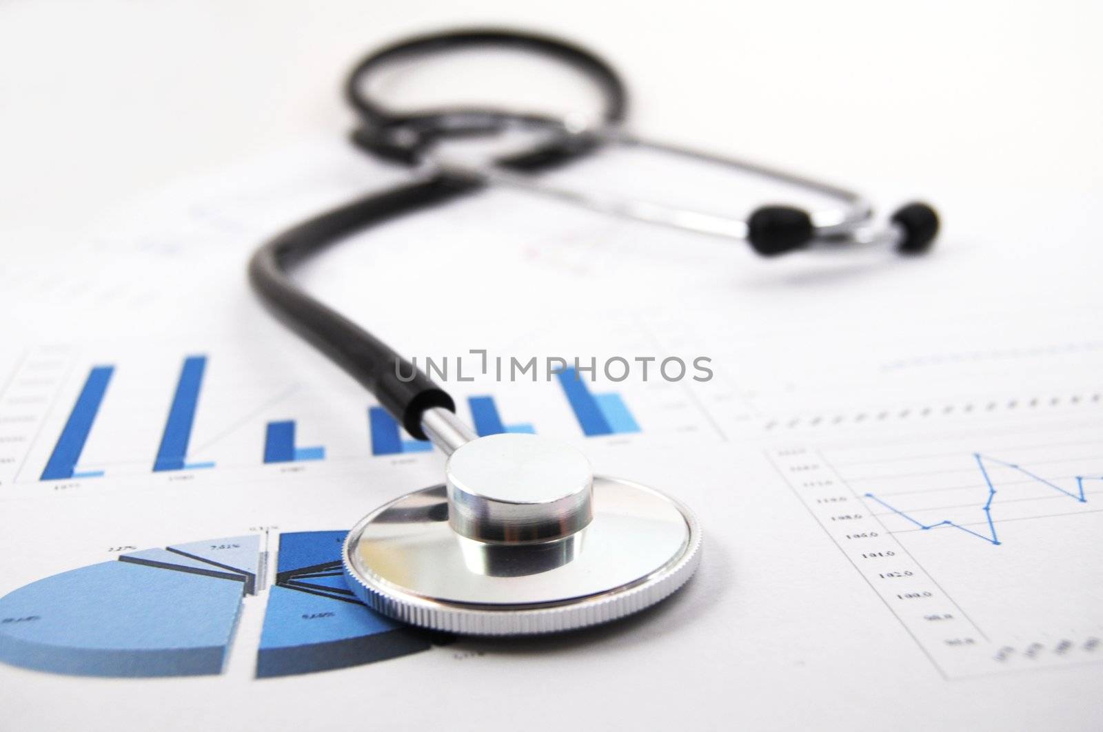 stethoscope on medical data chart in hospital