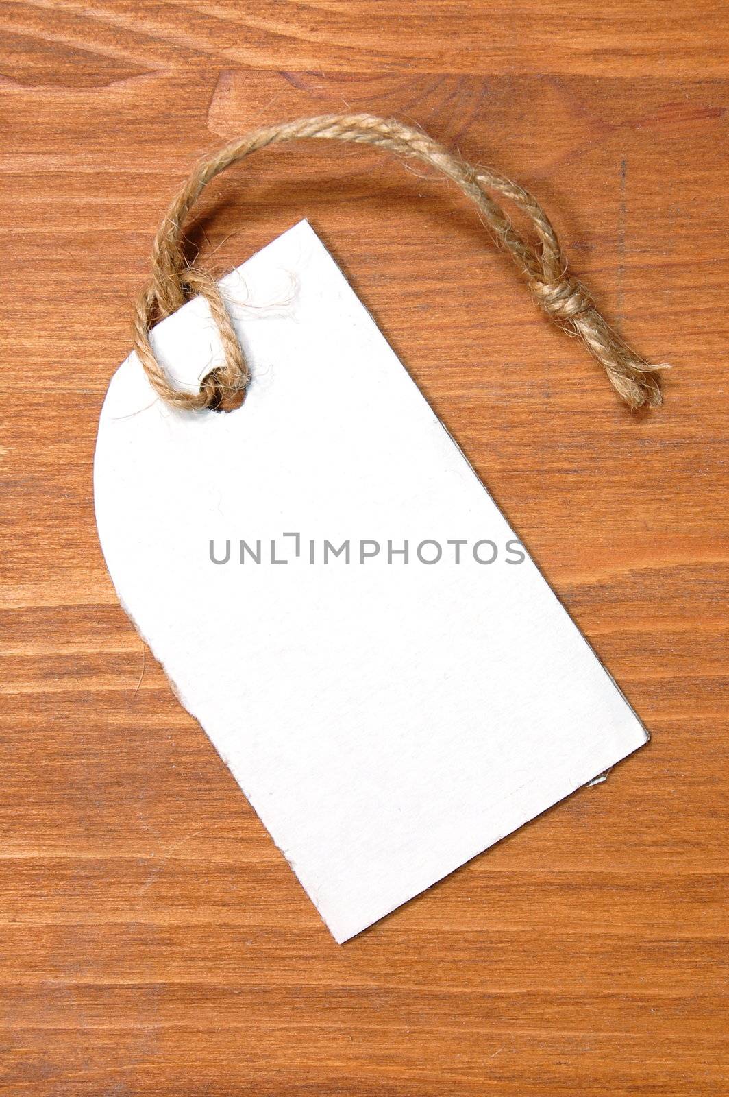 blank price tag with copyspace on a wood texture