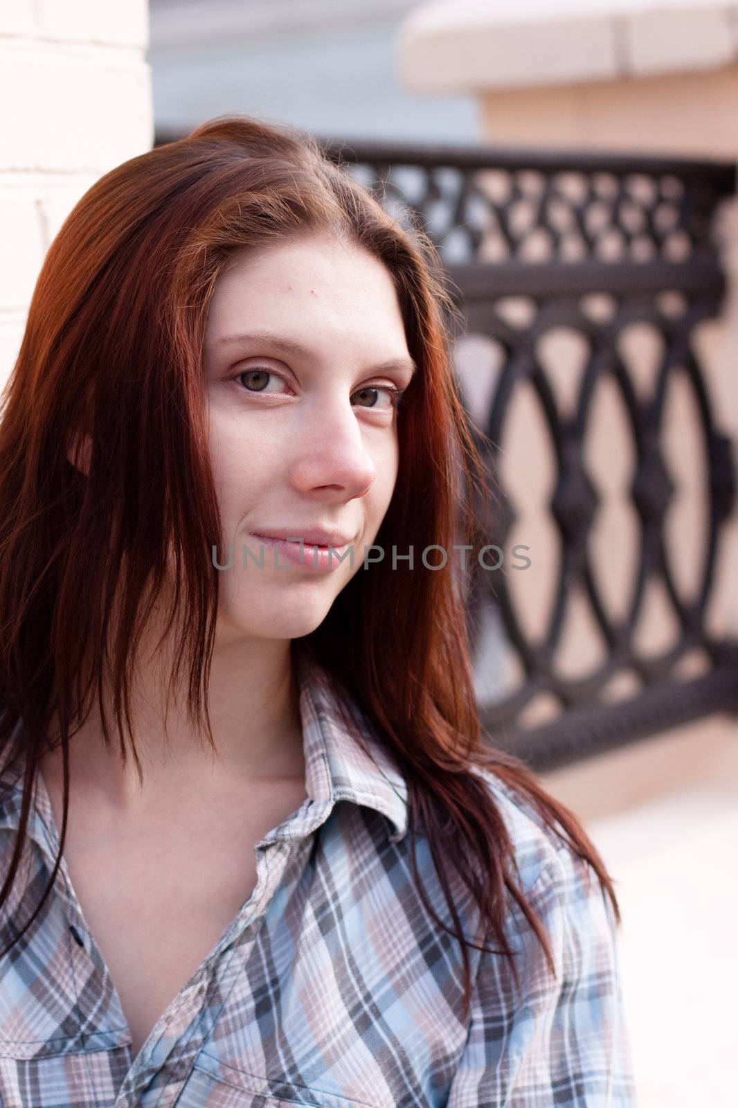 Portrait of young girl with red hair
