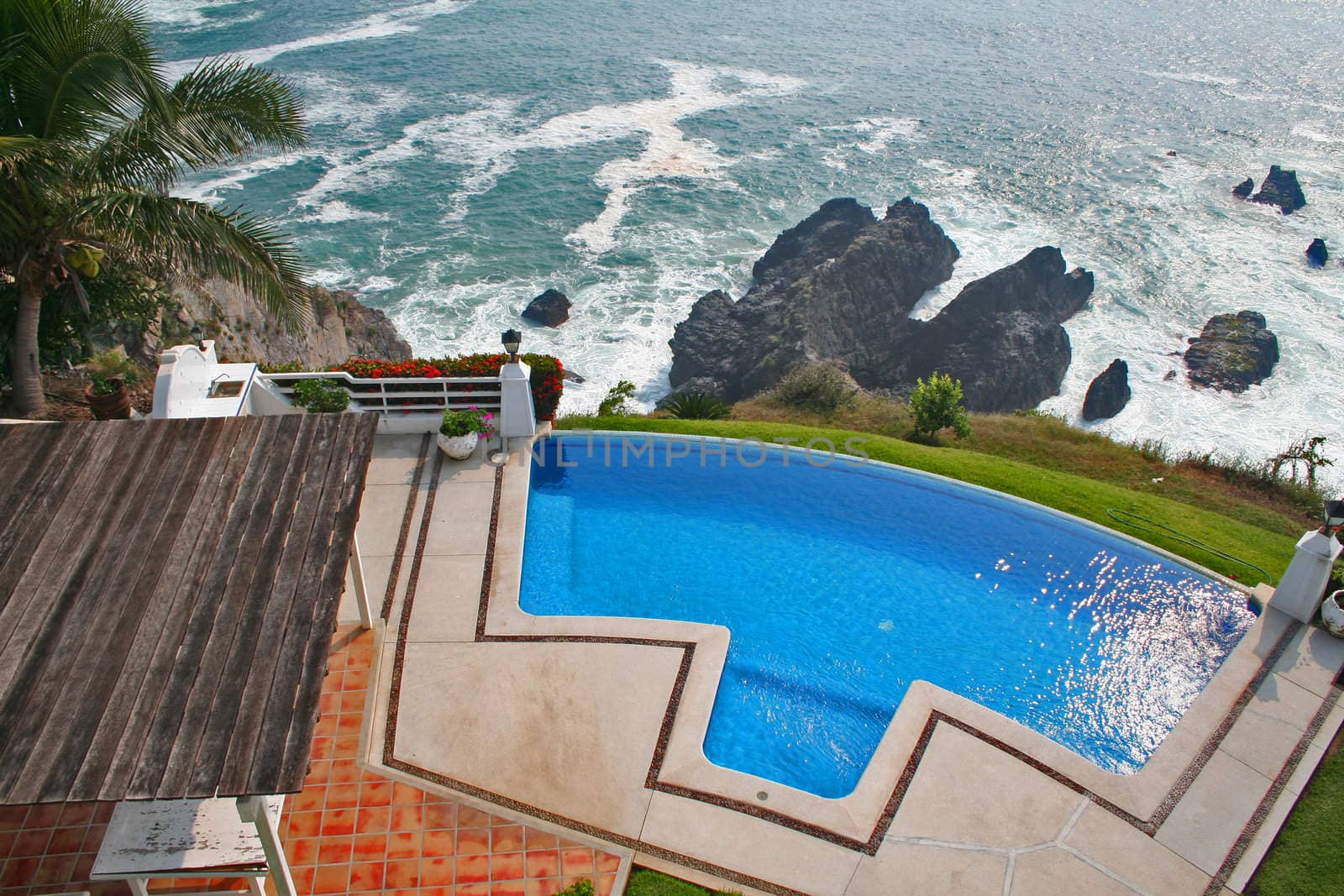 Luxury tropical pool overlooking ocean