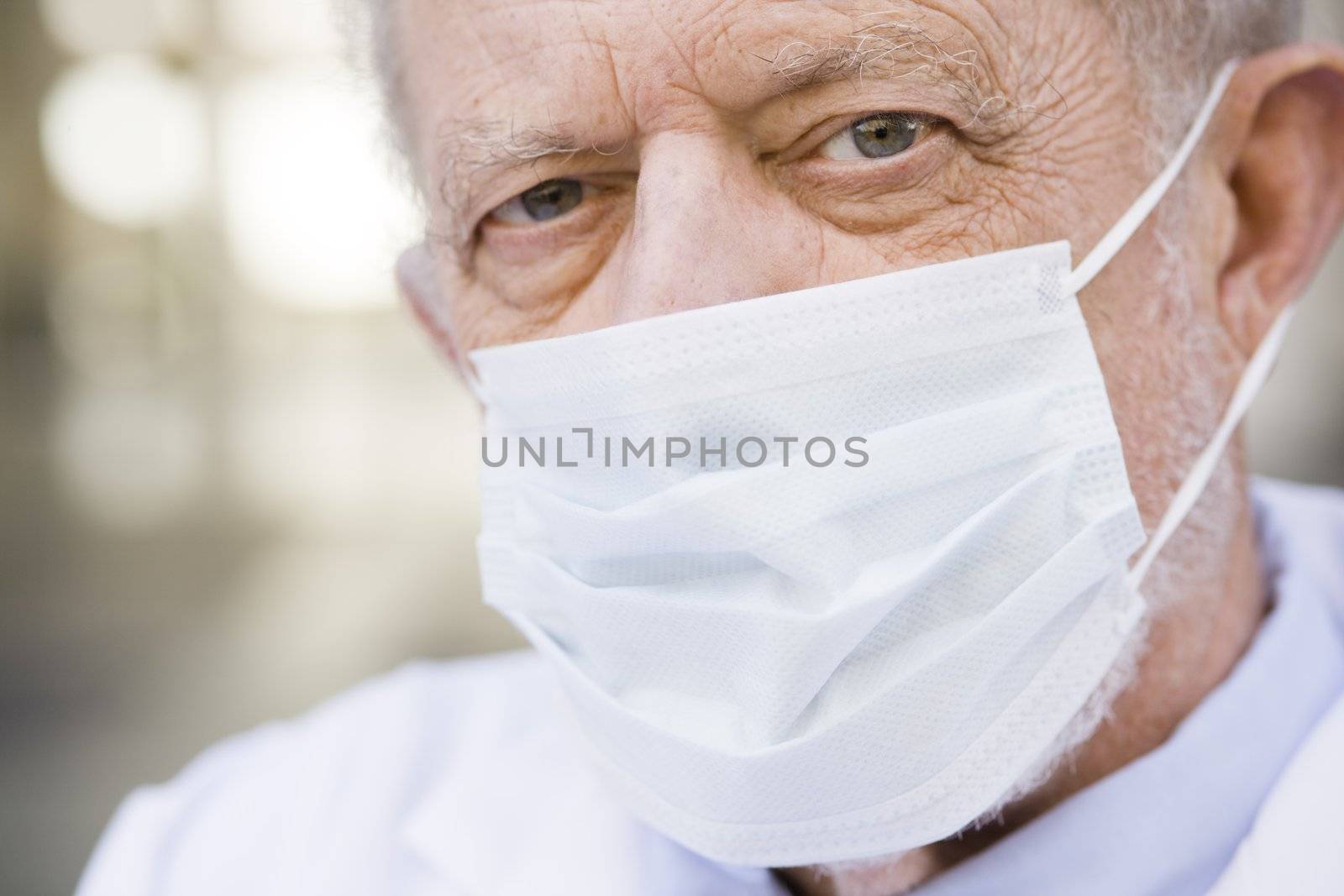 Portrait of an Old Male Doctor Wearing a Mask over His Nose and Mouth