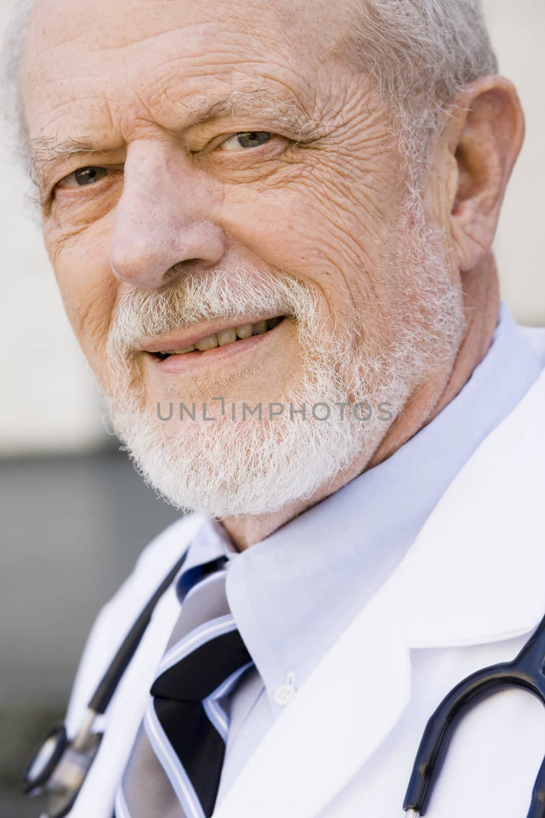 Smiling Male Doctor by ptimages