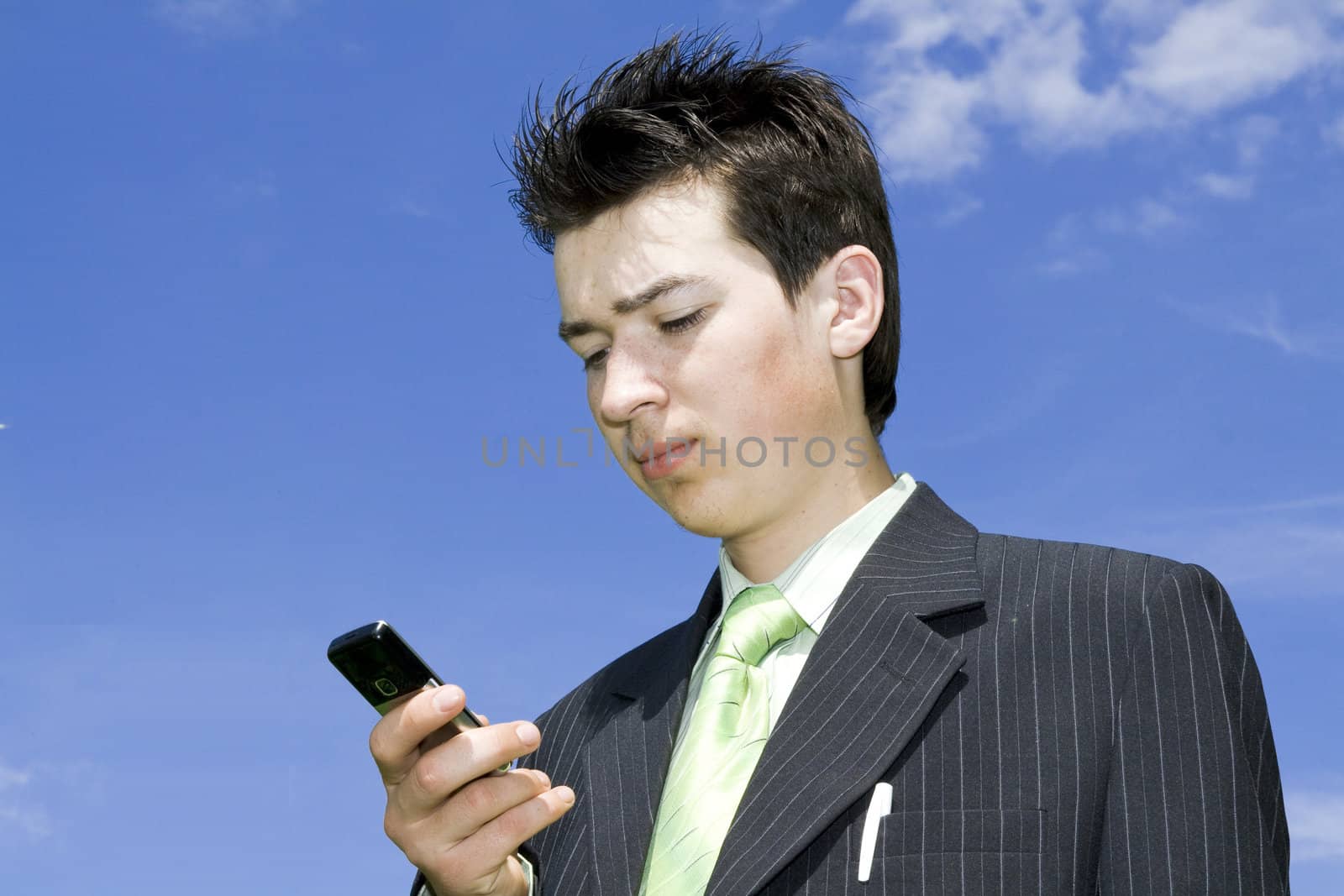 Businessman with cellphone by Nikonas