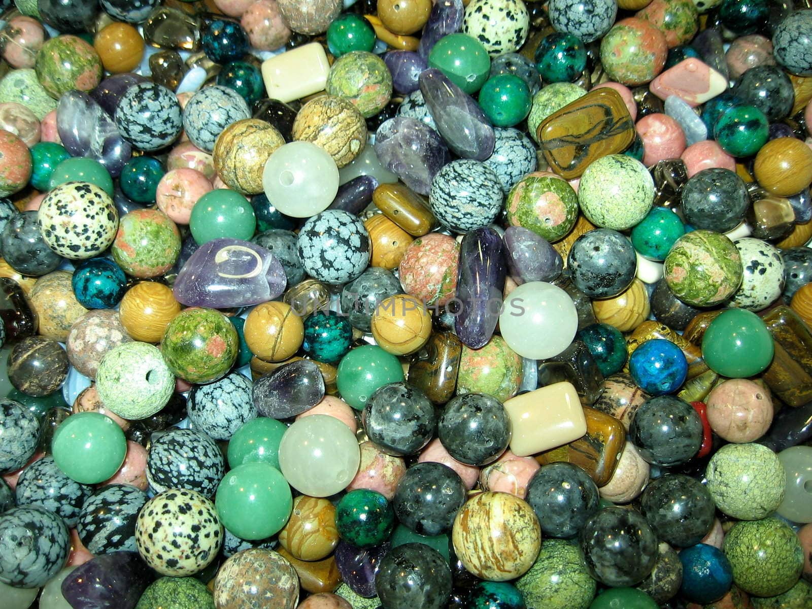 Various colour little stones are on a background
