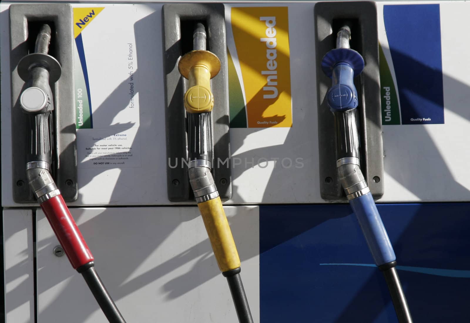 Three Petrol Pumps, Red, Yellow, Blue