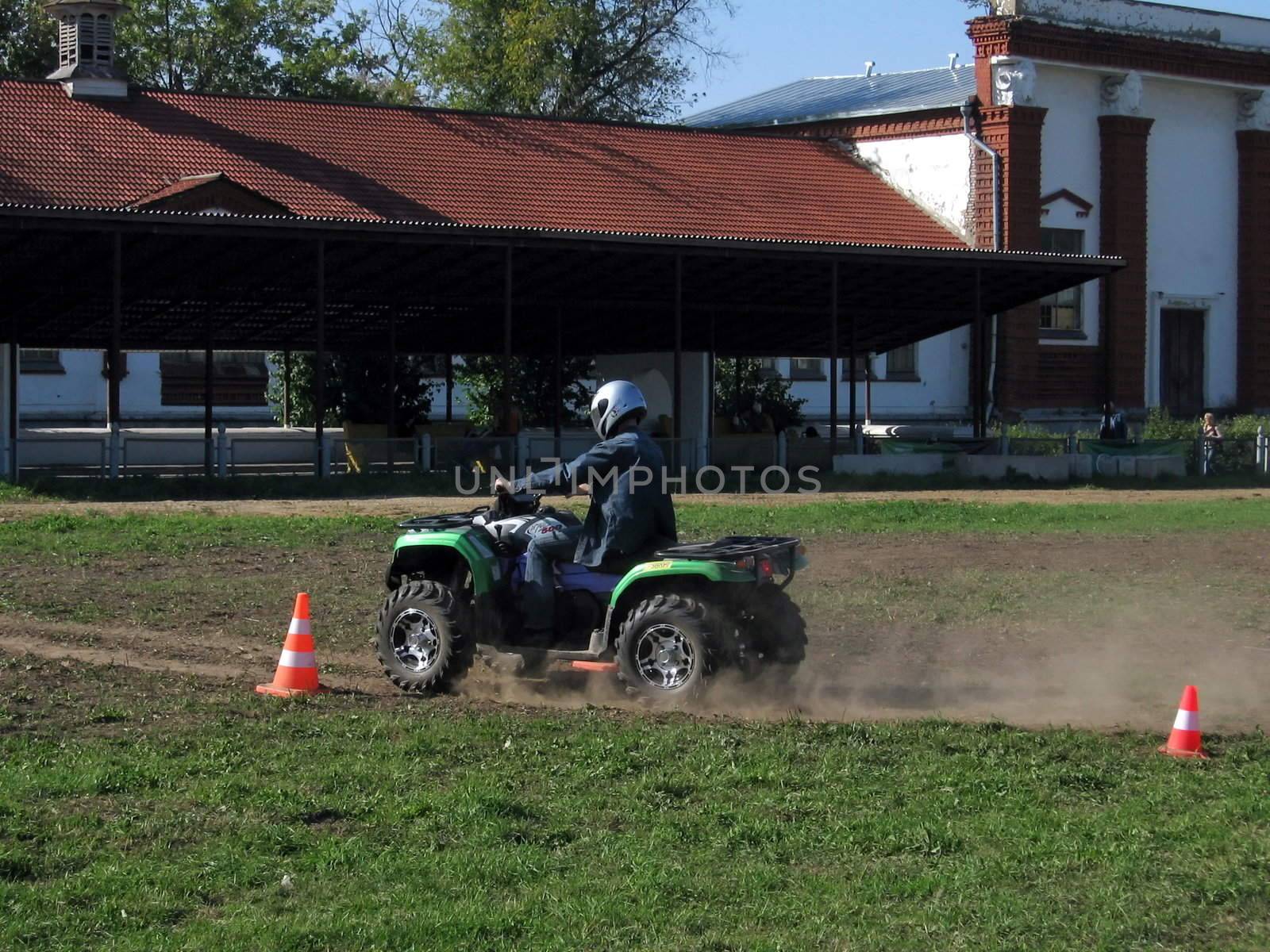 Man on a motorcycle moves along path