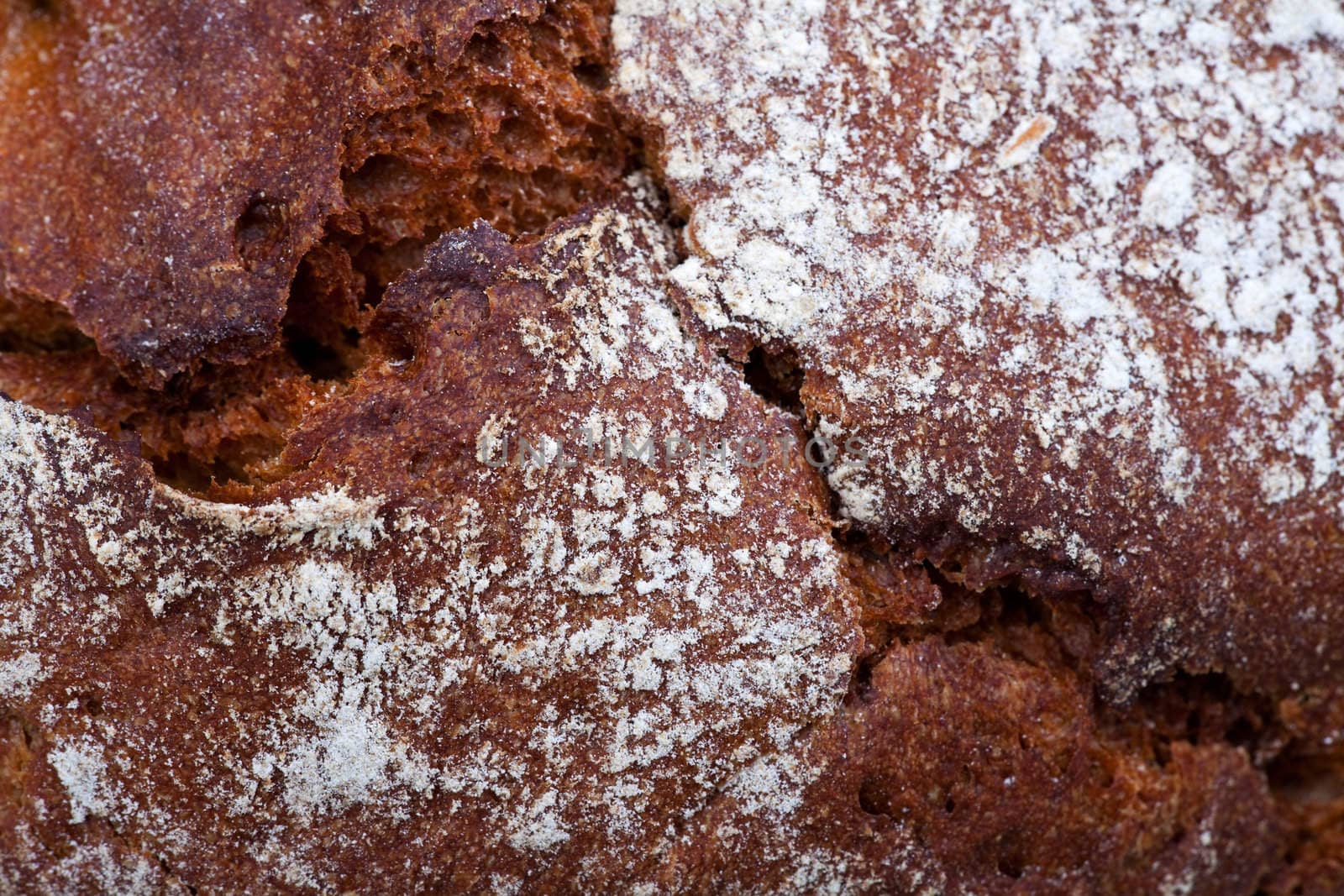 macro detail of a loaf of bread by bernjuer