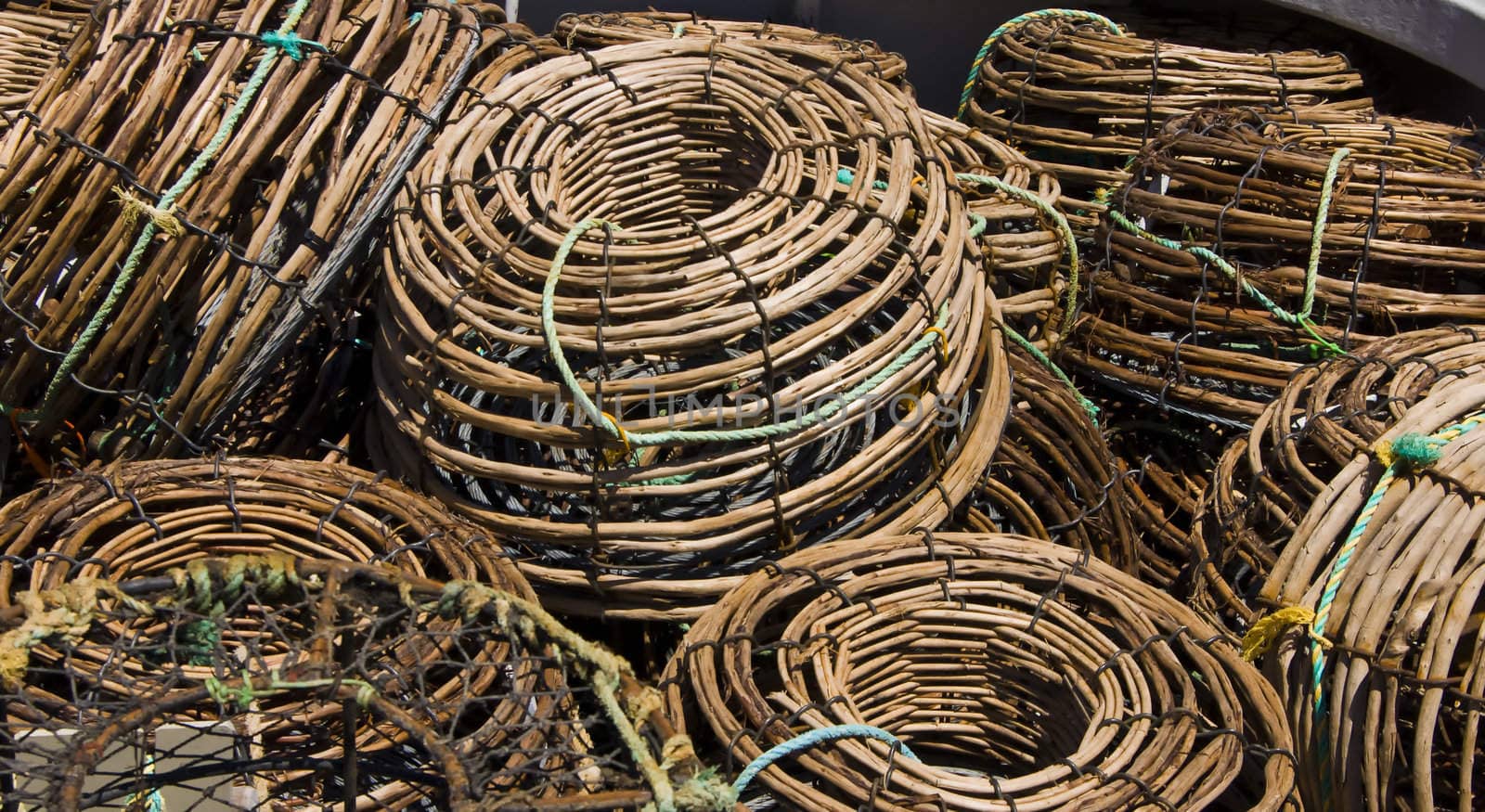 A pile of lobster pots sit on the deck of a boat on the North West coast of Tasmania.