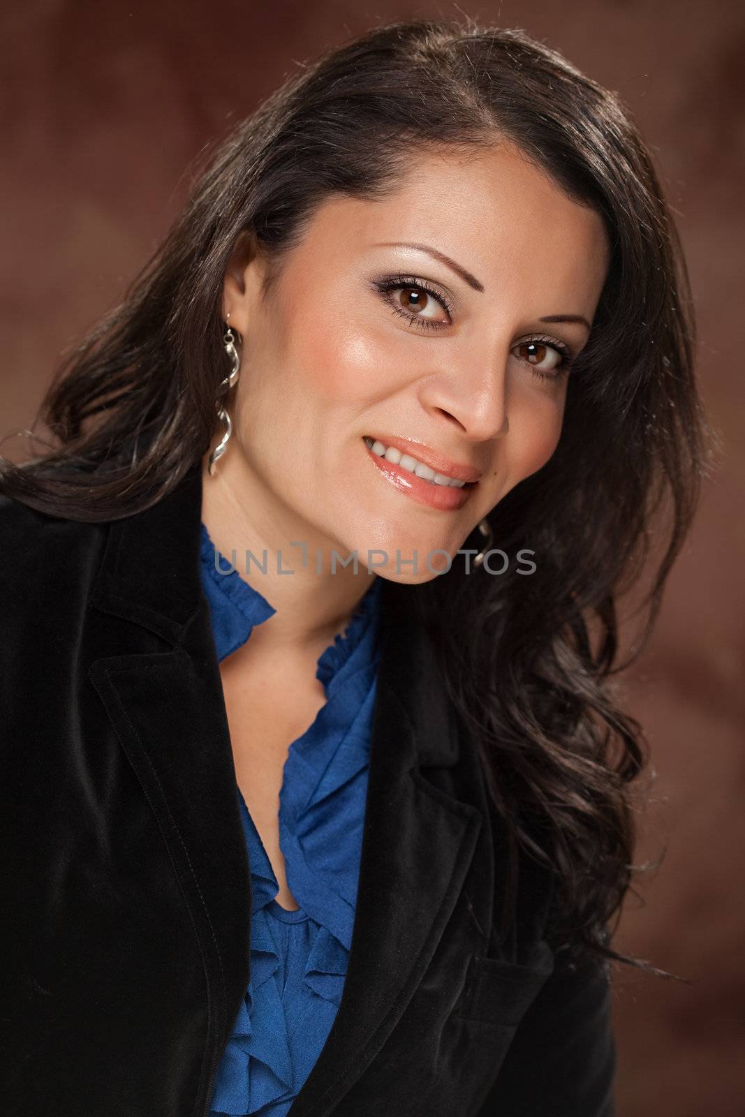 Attractive Hispanic Woman Poses for an Inside Studio Portrait.