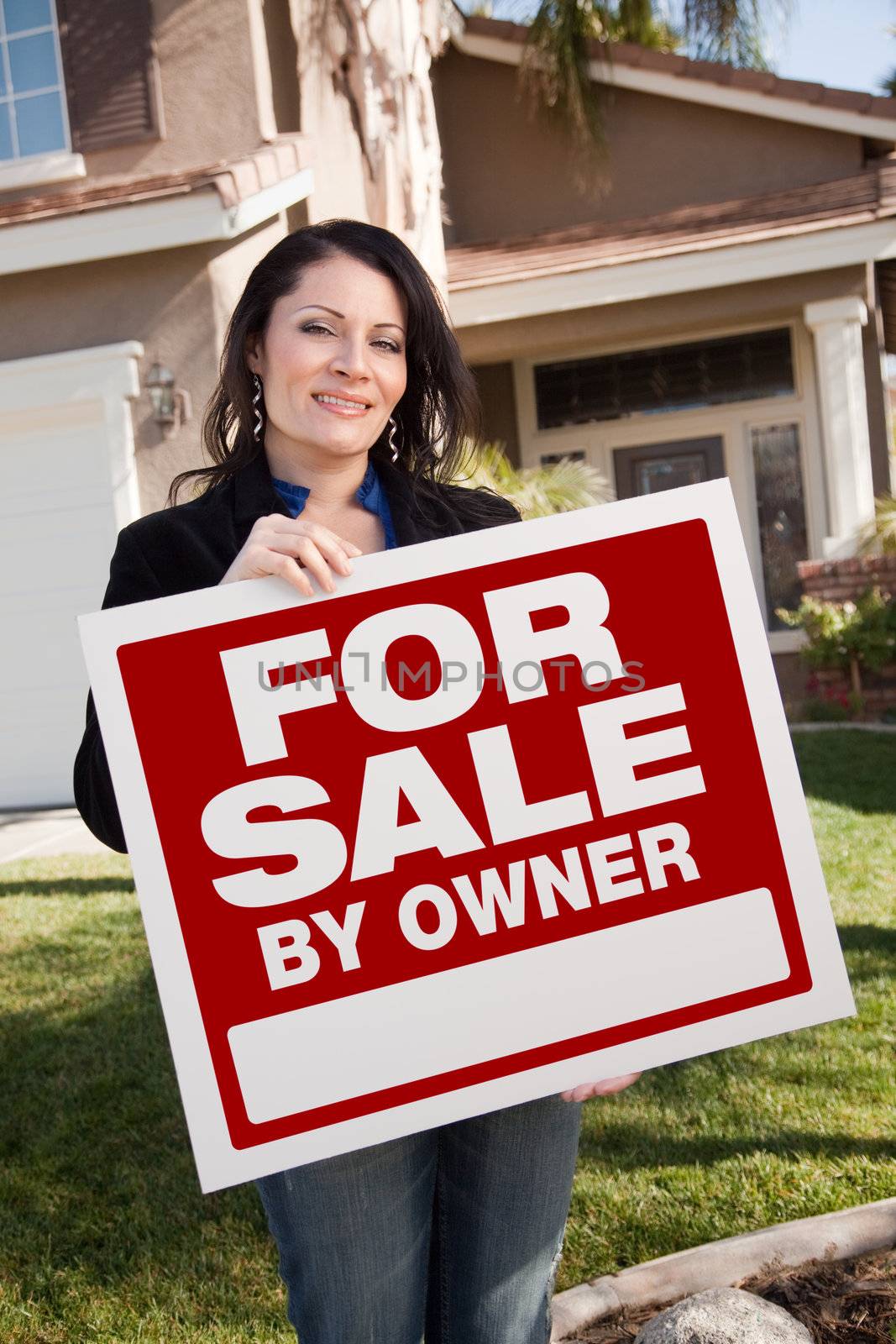 Hispanic Woman Holding For Sale By Owner Real Estate Sign In Fro by Feverpitched