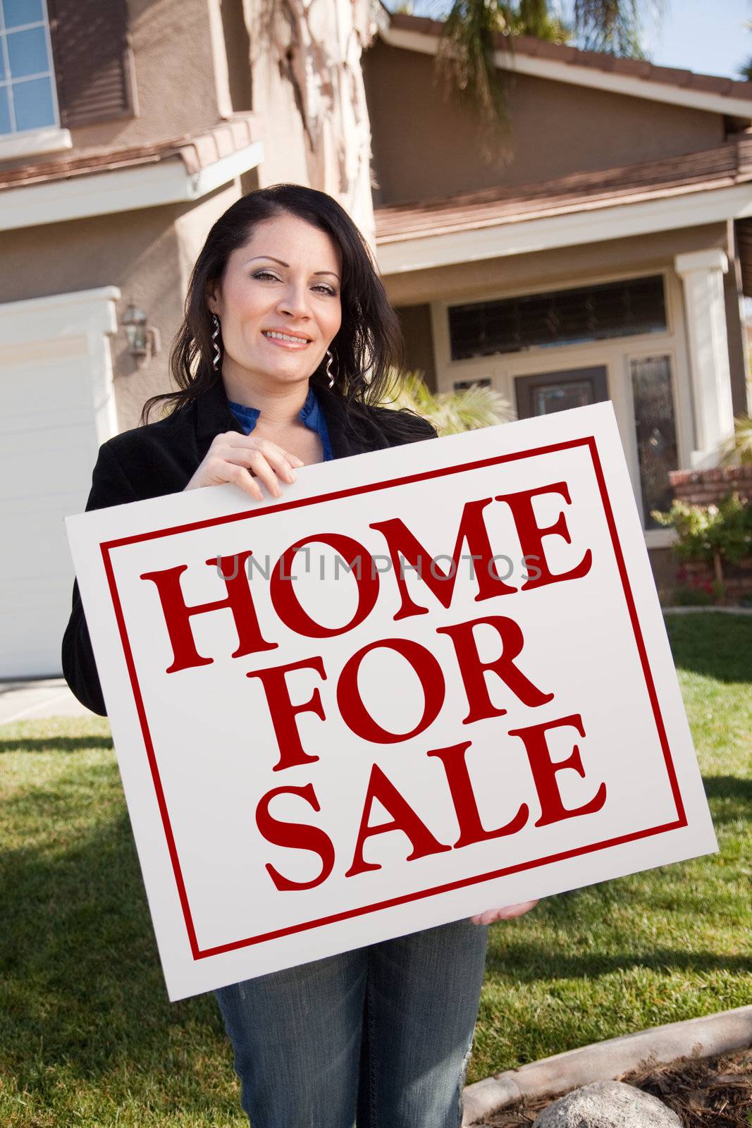 Woman Holding Home For Sale Real Estate Sign In Front of House by Feverpitched