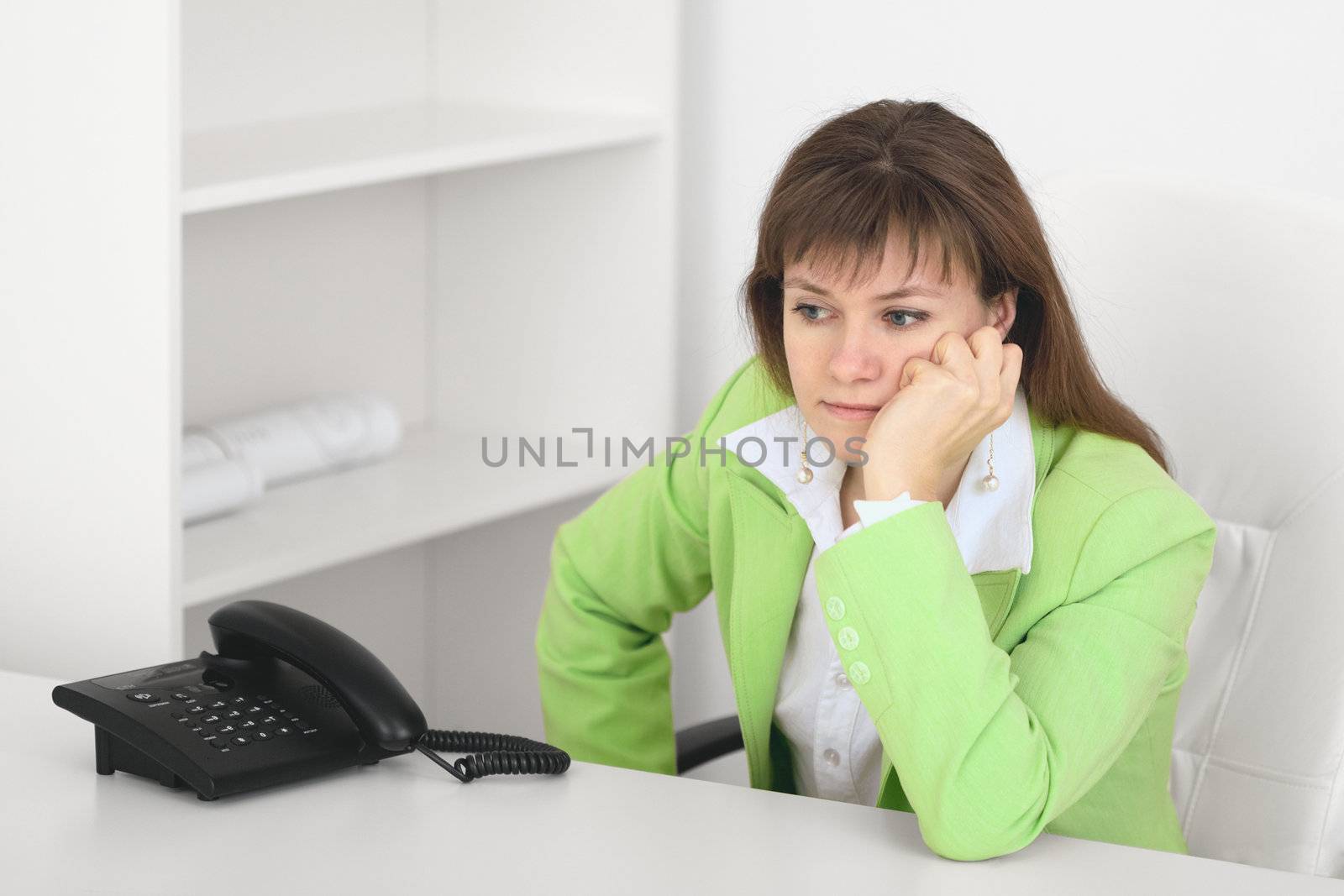 Tired manager reflects at office sitting at table by pzaxe