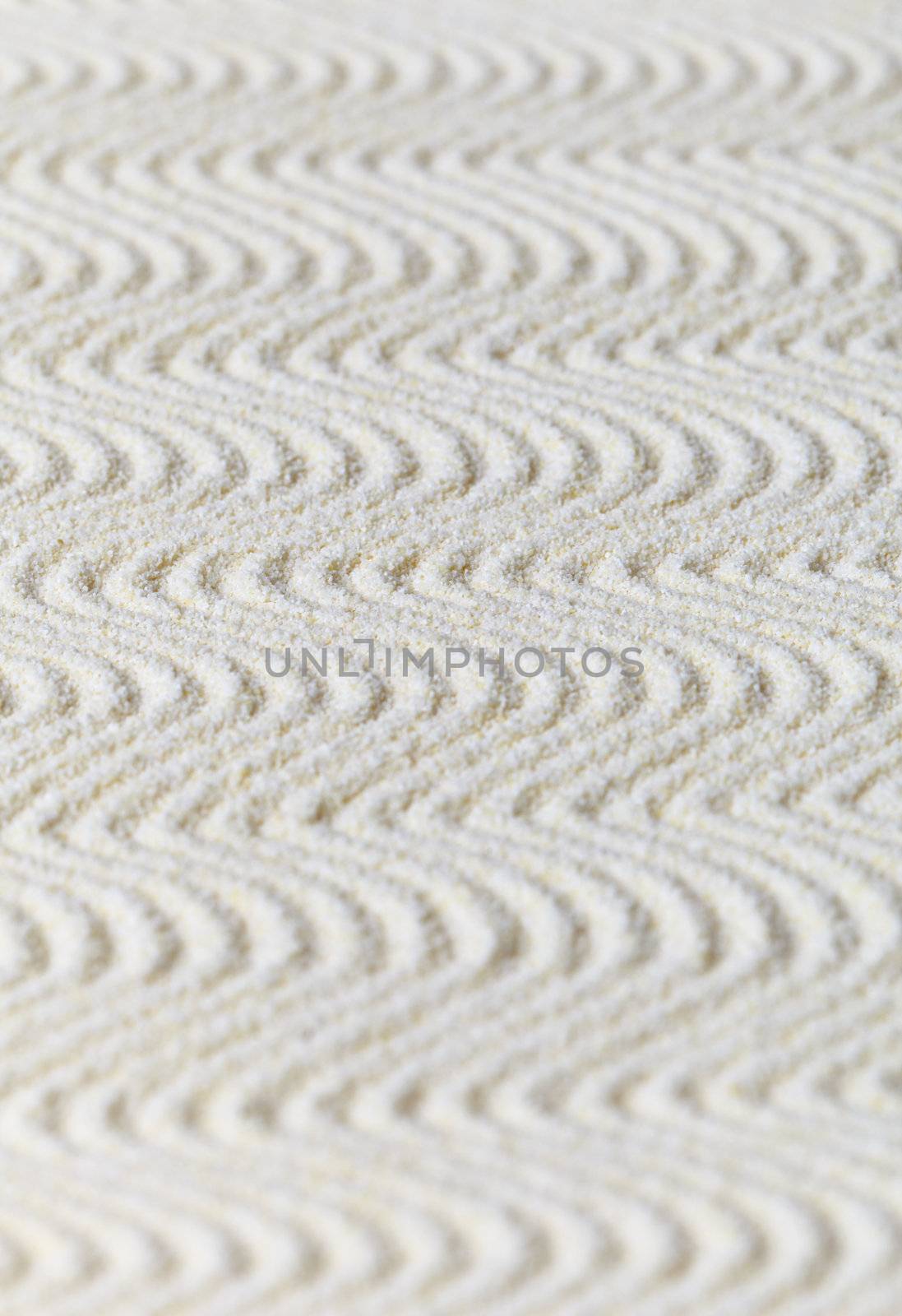 Wavy surface of sand - an abstract background