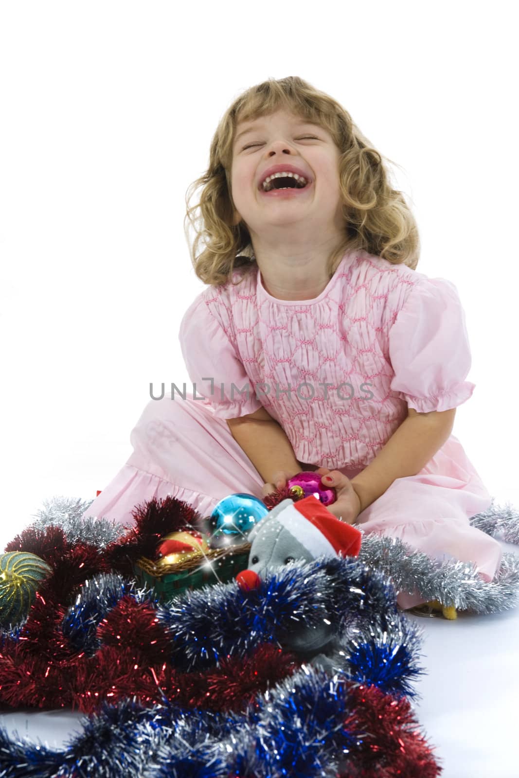 Beautiful little girl with christmas decoration on isolated background