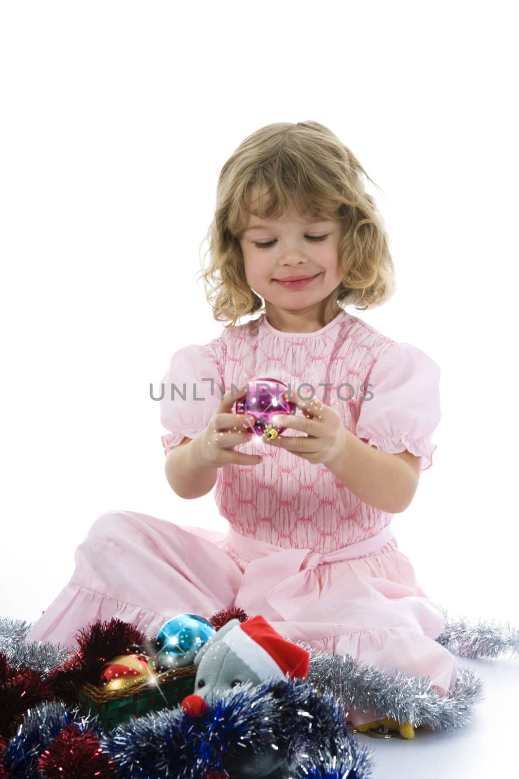 Beautiful little girl with christmas decoration on isolated background