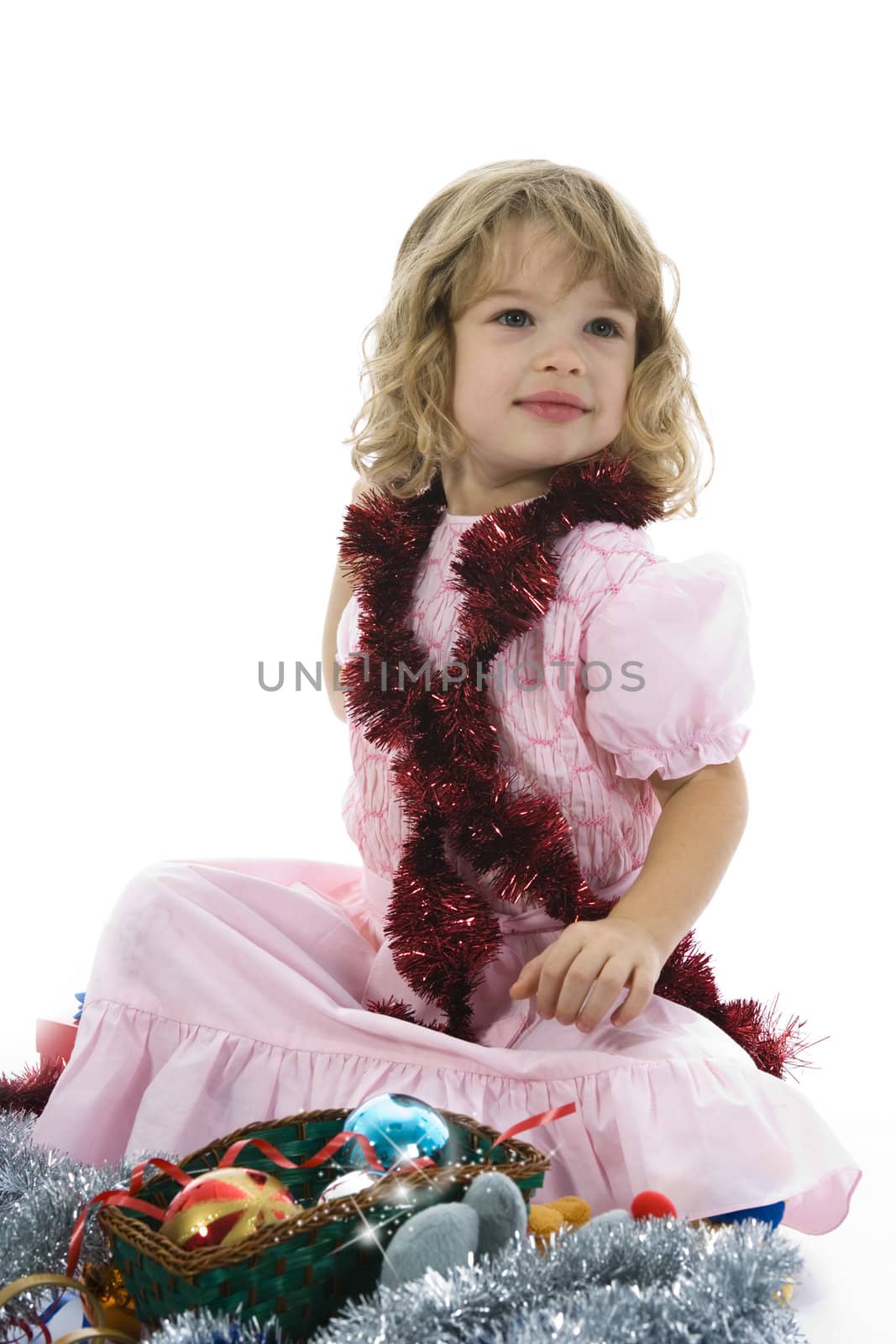Beautiful little girl with christmas decoration on isolated background