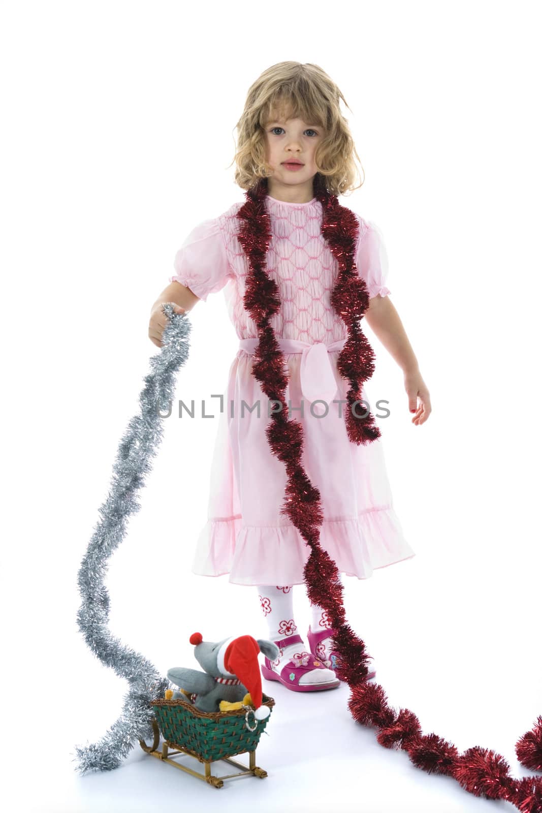 Beautiful little girl with christmas decoration on isolated background